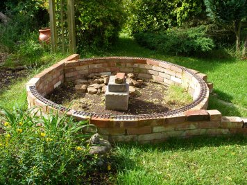 Brick circle with three quarters of a circle of track.